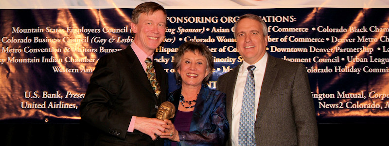 Receiving the MLK Award from current Colorado Governor John Hickenlooper and former Governor Bill Ritter